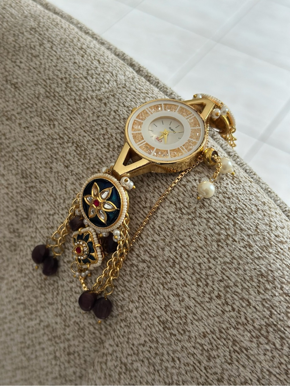 Gold-Tone Floral Charm Women's Bracelet Watch with Black Enamel Accents